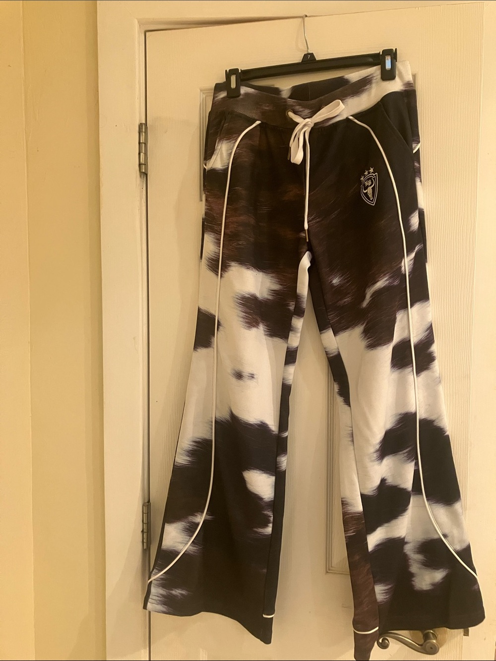 Hellbent by Cloonee Cowprint Track Pants— Brown & White